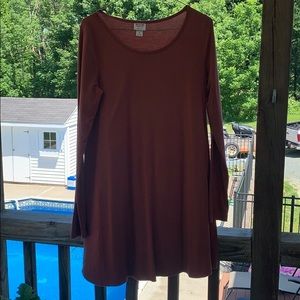 A burnt orange long sleeve t-shirt dress.